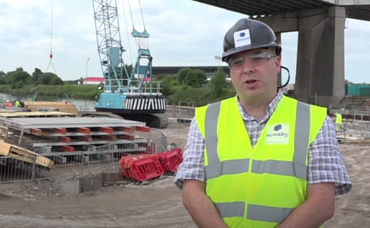 thumbnail for video case study. Image shows construction manager describing how concrete frames were used in bridge construction.